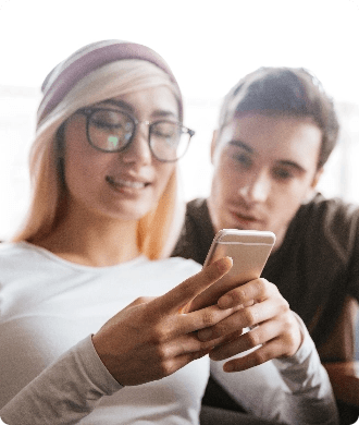 Couple looking at smartphone together